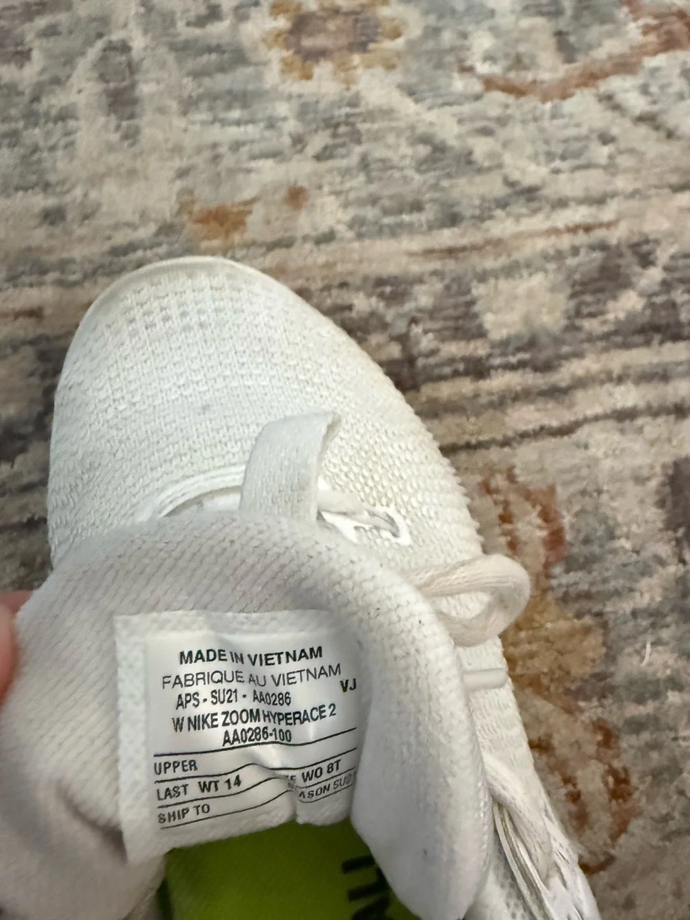 Nike women’s White Athletic Sneakers with Black Swoosh and Neon Green Lining